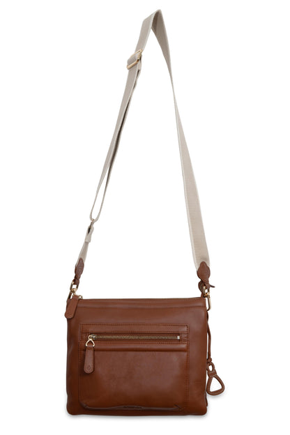 Brown leather crossbody bag with a beige strap on a white background